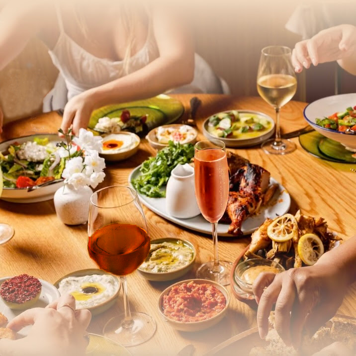 diners enjoy glasses of wine and a charcuterie board